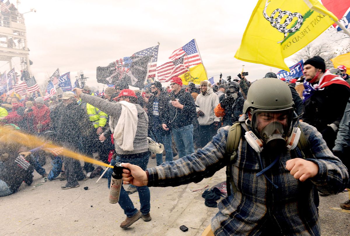 Trump supporters clash with police and security forces as people try to storm the US Capitol Building in Washington, DC, on January 6, 2021. - Demonstrators breeched security and entered the Capitol as Congress debated the a 2020 presidential election Electoral Vote Certification. (JOSEPH PREZIOSO/AFP via Getty Images)