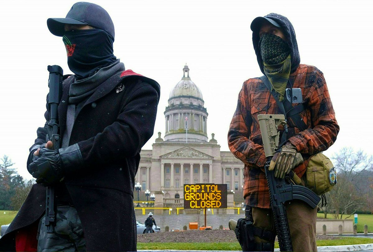 Members of the Boogaloo movement hold their rifles in front of the state capitol building in Frankfort, Kentucky, on January 17, 2021, during a nationwide protest called by anti-government and far-right groups supporting US President Donald Trump and his claim of electoral fraud in the November 3 presidential election. - The FBI warned authorities in all 50 states to prepare for armed protests at state capitals in the days leading up to the January 20 presidential inauguration of President-elect Joe Biden. (JEFF DEAN/AFP via Getty Images)