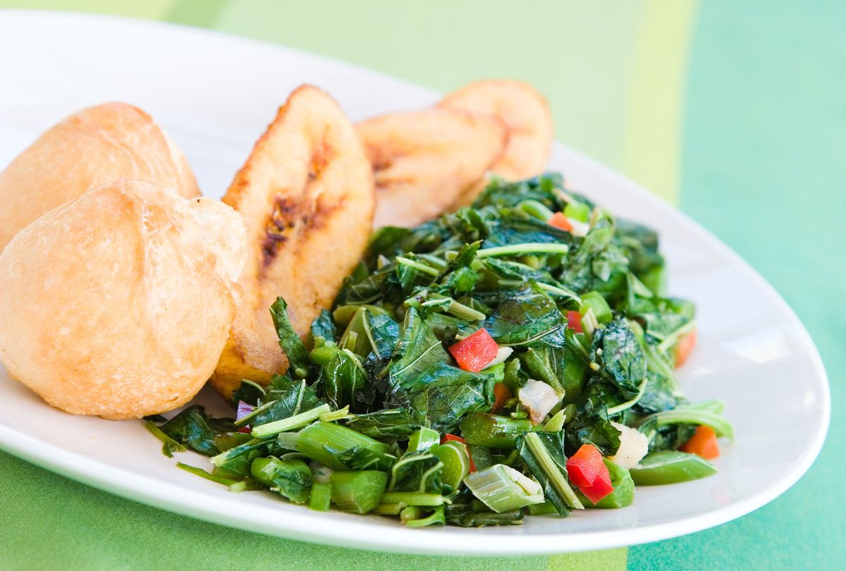 Speciality caribbean dish of callaloo (spinach) served with fried dumplings (Getty Images)