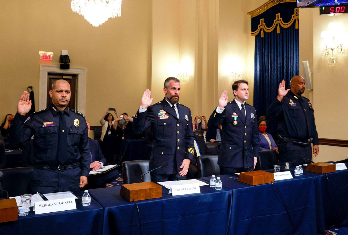 US Capitol Police Sergeant Aquilino Gonell, DC Metropolitan Police Department Officer Michael Fanone, DC Metropolitan Police Department Officer Daniel Hodges and US Capitol Police Private First Class Harry Dunn, are sworn in before members of the Select Committee, as they investigate the January 6, 2021, attack on the US Capitol, during their first hearing on Capitol Hill in Washington, DC, on July 27, 2021. - The committee will hear testimony from members of the US Capitol Police and the Metropolitan Police Department who tried to protect the Capitol against insurrectionists on January 6, 2021. (JIM BOURG/POOL/AFP via Getty Images)