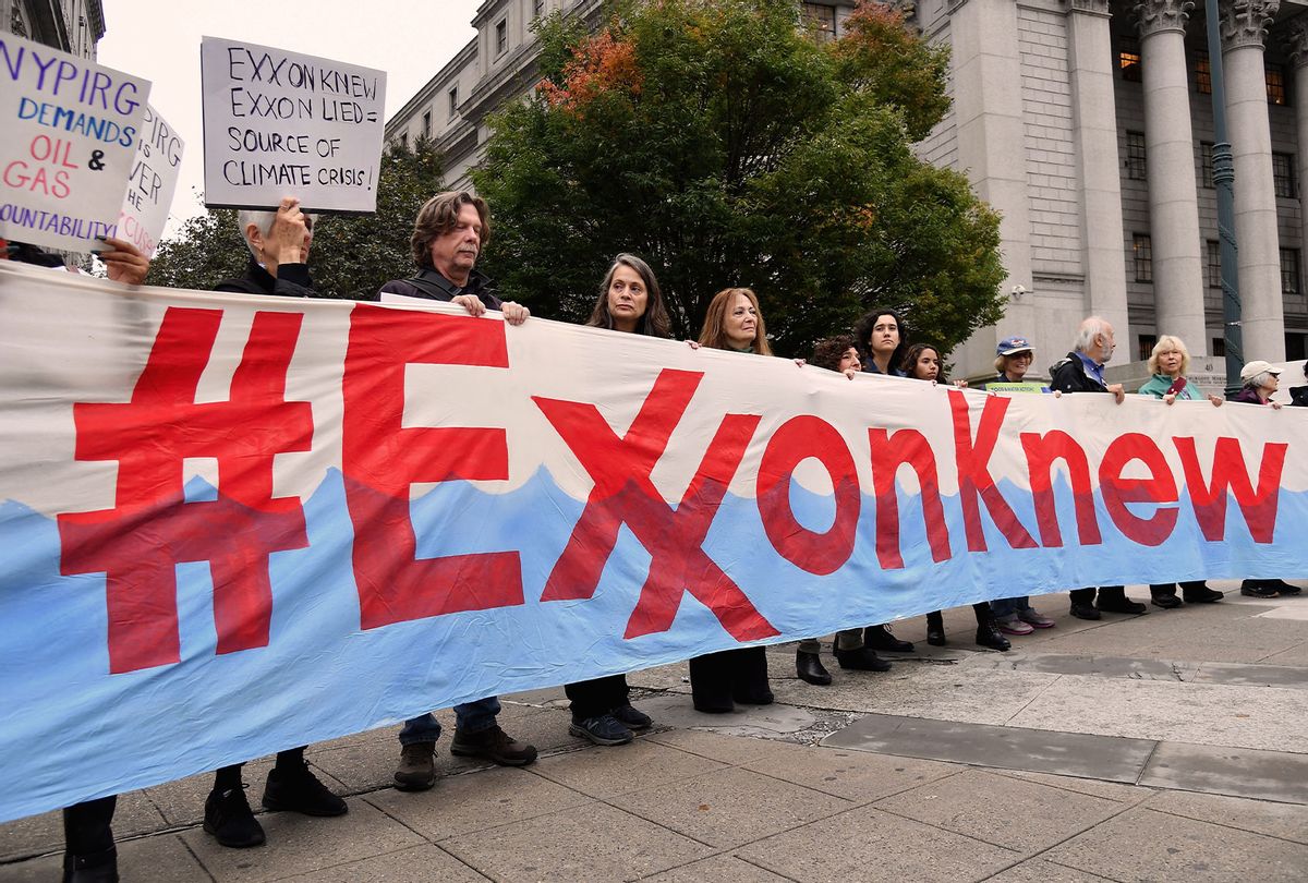Climate activists protest on the first day of the Exxon Mobil trial outside the New York State Supreme Court building on October 22, 2019 in New York City. - Charges that Exxon Mobil misled investors on the financial risks of climate change will be heard in court after a New York judge gave the green light for a trial. (ANGELA WEISS/AFP via Getty Images)