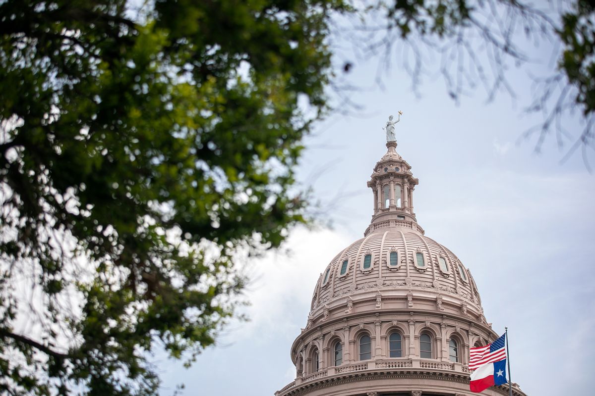 The U.S. and Texas flags wave outside the Texas Capitol on July 13, 2021 in Austin, Texas.  (Montinique Monroe/Getty Images)