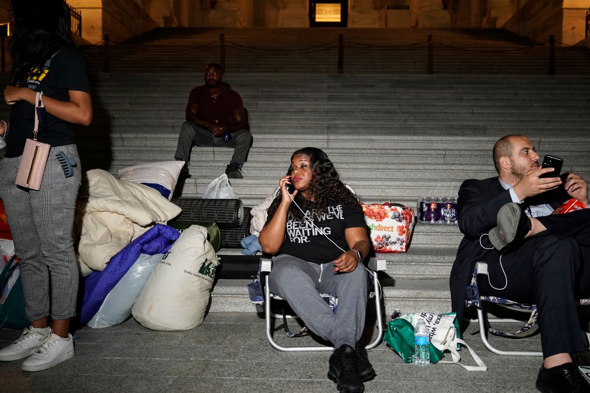 Rep. Cori Bush speaks with supporters as she spends the night outside the U.S. Capitol to call for for an extension of the federal eviction moratorium on July 31, 2021. (Getty Images)