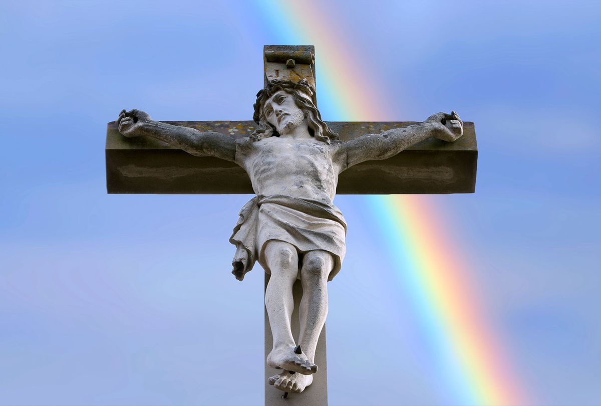 Rainbow behind a stone cross with Jesus (Getty Images/Werner Images)