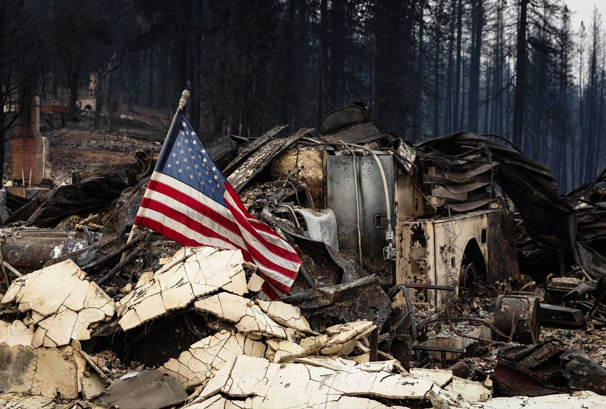 An American flag is placed amidst the rubble on August 8, 2021 in Greenville, California. The Dixie Fire, which has incinerated more than 463,000 acres, is the second largest recorded wildfire in state history and remains only 21 percent contained. (Maranie R. Staab/Getty Images)