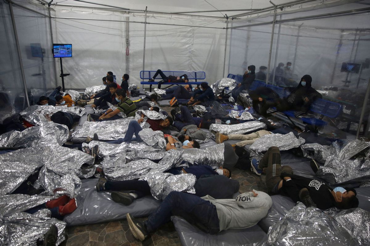 Young children rest inside a pod at the Donna Department of Homeland Security holding facility, the main detention center for unaccompanied children in the Rio Grande Valley. (DARIO LOPEZ-MILLS/POOL/AFP via Getty Images)