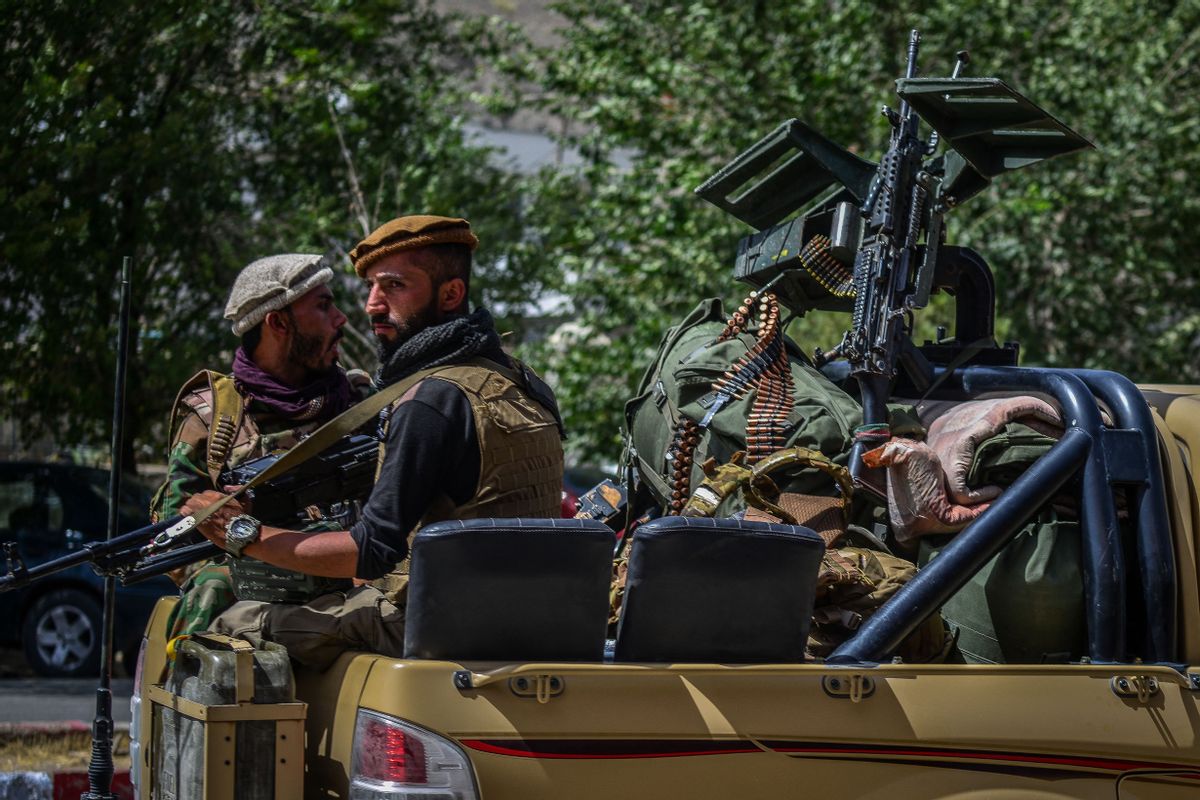 Soldiers from Afghan Security forces travel on a armed vehicle along a road in Panjshir province of Afghanistan on August 15, 2021.  (AHMAD SAHEL ARMAN/AFP via Getty Images)