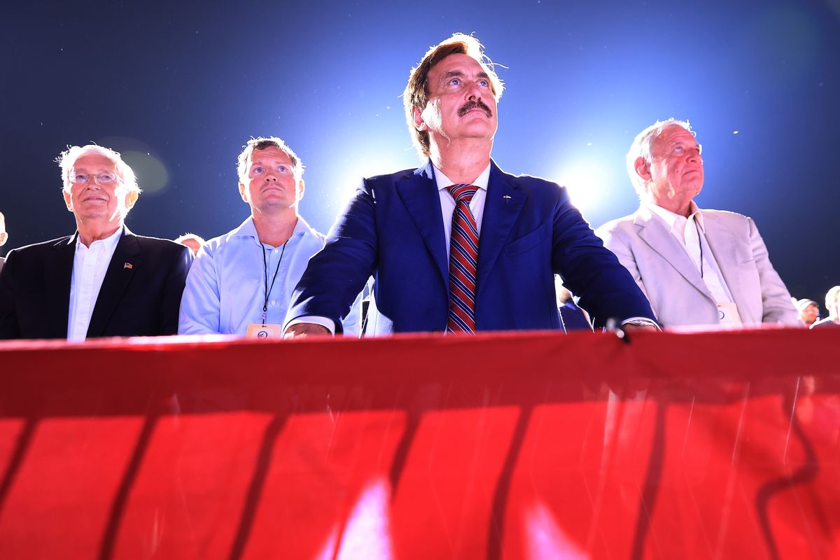 Founder and CEO of My Pillow, conservative political activist and conspiracy theorist Mike Lindell listens to former U.S. President Donald Trump addresses supporters during a "Save America" rally. (Chip Somodevilla/Getty Images)