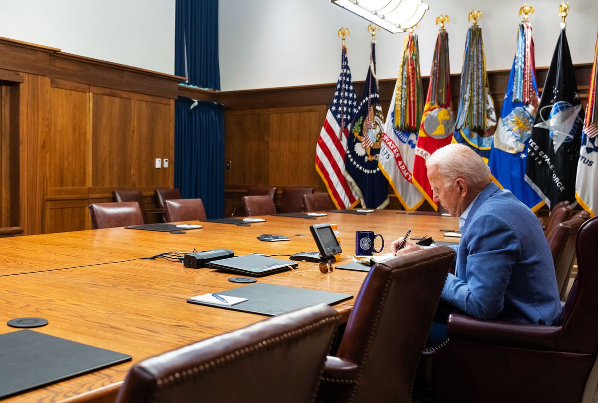 In this White House handout, U.S. President Joe Biden and Vice President Kamala Harris (off-camera) hold a video conference with the national security team to discuss the ongoing efforts to draw down our civilian footprint in Afghanistan August 16, 2021 at Camp David in Frederick County, Maryland. In addition, the President and Vice President were briefed on the earthquake in Haiti. (White House via Getty Images)