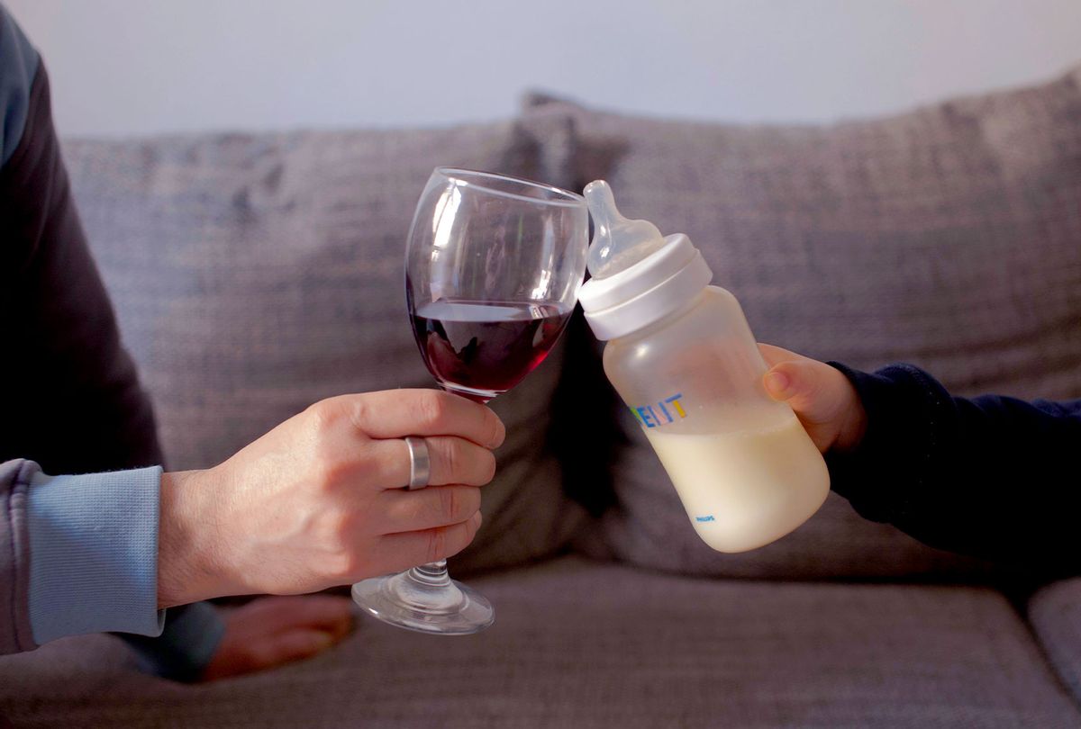 Father And Son Toasting Wineglass And Milk Bottle (Getty Images/Monica Monti/EyeEm)