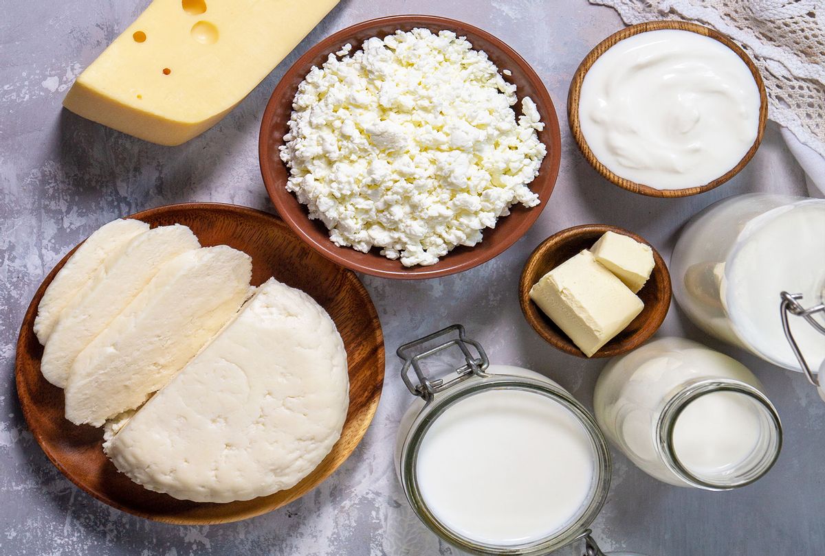 Various fresh dairy products, milk, sour cream, cottage cheese, yogurt and butter on a light stone countertop (Getty Images/Elena Hramowa)
