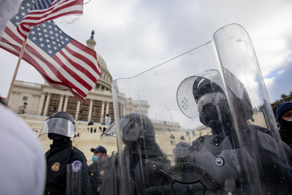 Pro-Trump protestors clash with police during the tally of electoral votes that that would certify Joe Biden as the winner of the U.S. presidential election outside the US Capitol in Washington, DC on Wednesday, January 6, 2021.  (Amanda Andrade-Rhoades/For The Washington Post via Getty Images)