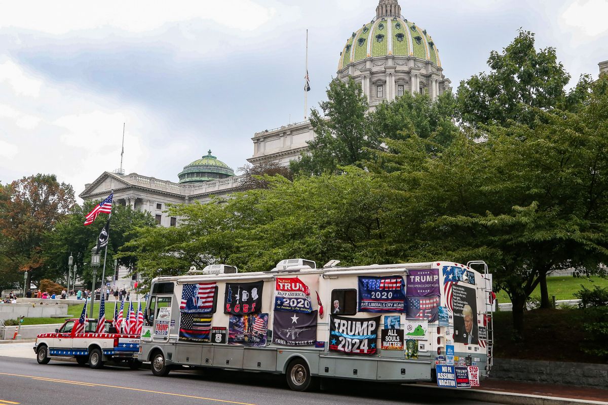 A recreational vehicle covered in pro-Trump signs seen parked near the Pennsylvania State Capitol in Harrisburg during the "Rally for Freedom" on Aug. 29. (Paul Weaver/SOPA Images/LightRocket via Getty Images)