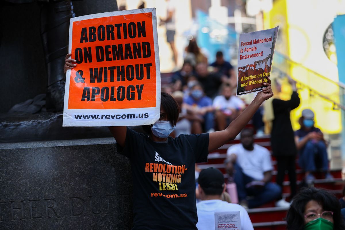 A group of people are gathered at the Times Square of New York City, United States on September 4, 2021 to protest that a Texas law banned abortion. (Tayfun Coskun/Anadolu Agency via Getty Images)