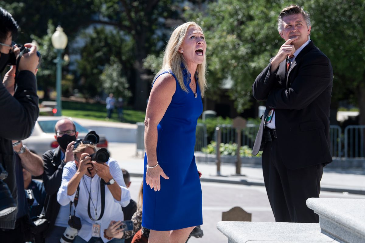 Rep. Marjorie Taylor Greene, R-Ga., argues with Rep. Debbie Dingell, D-Mich., off camera, during by a Build Back Better for Women rally held by Democrats on the House steps of the U.S. Capitol on Friday, September 24, 2021. (Tom Williams/CQ-Roll Call, Inc via Getty Images)