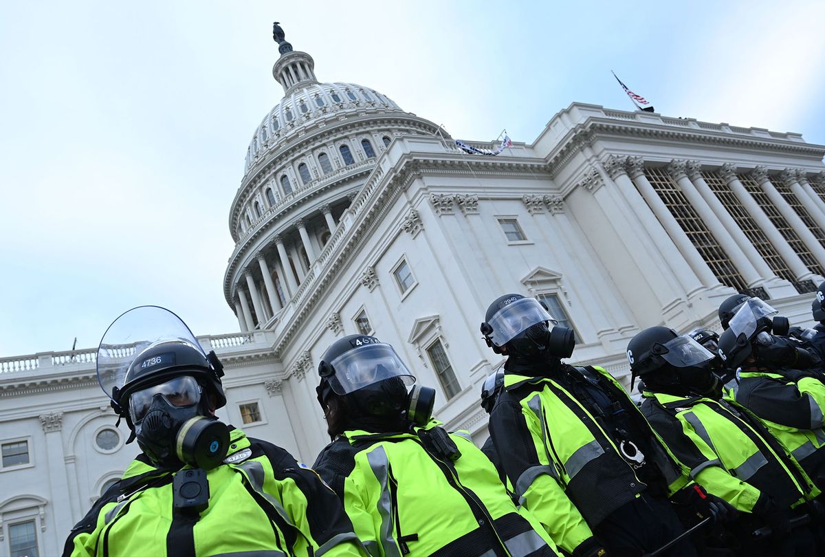 Police stand as supporters of US President Donald Trump protest outside the US Capitol on January 6, 2021, in Washington, DC. (BRENDAN SMIALOWSKI/AFP via Getty Images)