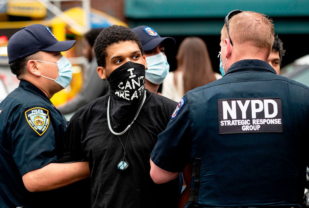 NYPD officers arrest a protestor during a "Black Lives Matter" demonstration on May 28, 2020 in New York City, in outrage over the death of a black man in Minnesota who died after a white policeman kneeled on his neck for several minutes. (JOHANNES EISELE/AFP via Getty Images)