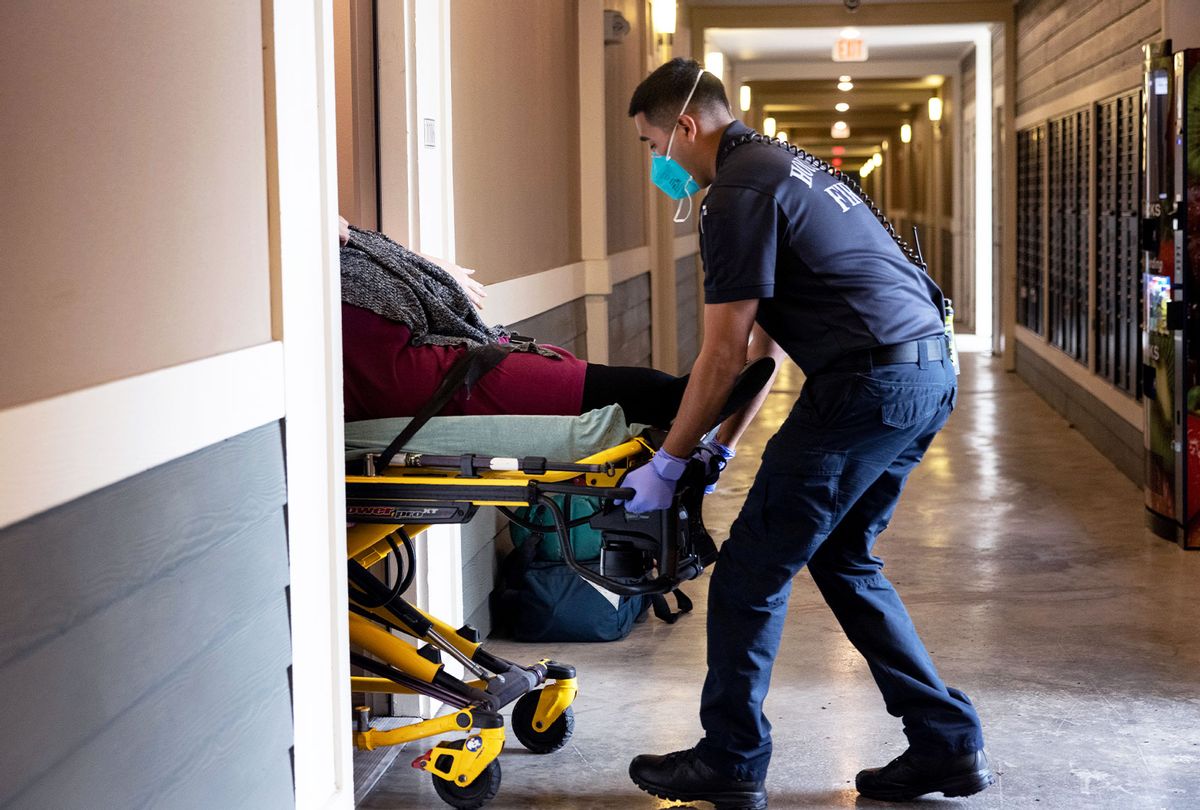 Houston Fire Department paramedics transport a woman with breathing difficulties to a hospital on September 14, 2021 in Houston, Texas. Texas' Harris County continues to see large number of Covid-19 hospitalizations due to the Delta variant surge in the state. (John Moore/Getty Images)