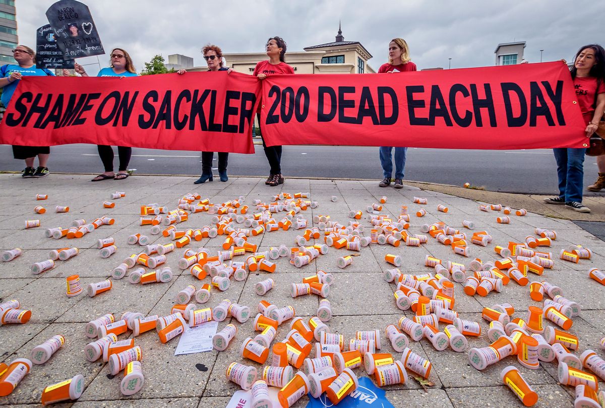 Members of P.A.I.N. (Prescription Addiction Intervention Now) and Truth Pharm staged a protest on September 12, 2019 outside Purdue Pharma headquarters in Stamford, over their recent controversial opioid settlement. Participants dropped hundreds prescription bottles of OxyContin while holding tombstones with the names of opioids casualties and banners reading "Shame on Sackler" and "200 Dead Each Day". (Erik McGregor/LightRocket via Getty Images)
