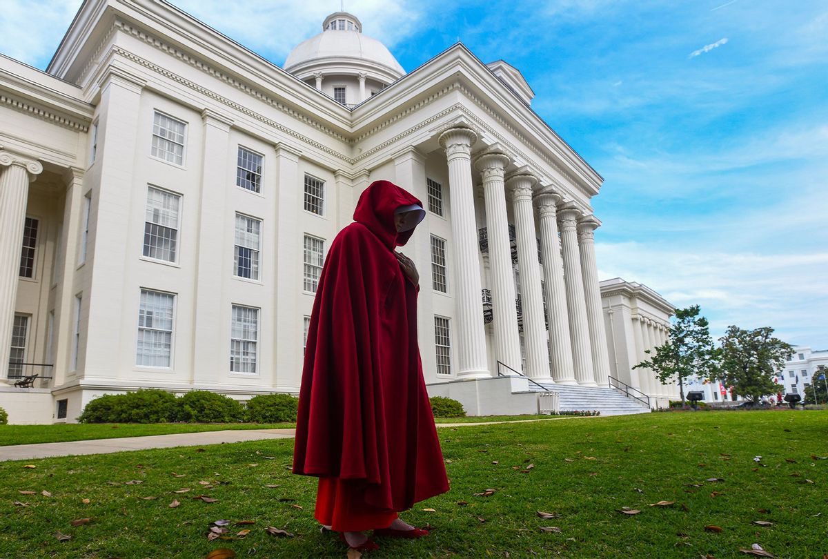 A protestor dressed as a character from the Hulu TV show "The Handmaid's Tale," based on the best-selling novel by Margaret Atwood, walks back to her car after participating in a rally against one of the nation's most restrictive bans on abortions on May 19, 2019 in Montgomery, Alabama. (Julie Bennett/Getty Images)