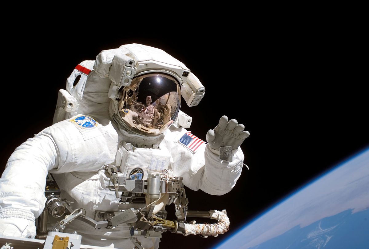 American astronaut Joseph Tanner waves to the camera during a space walk as part of the STS-115 mission to the International Space Station, September 2006 (NASA/Getty Images)