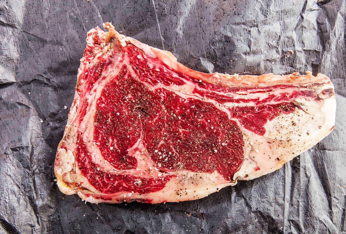 Cut of raw Normande beef on black packaging paper (Getty Images/Annick Vanderschelden Photography)