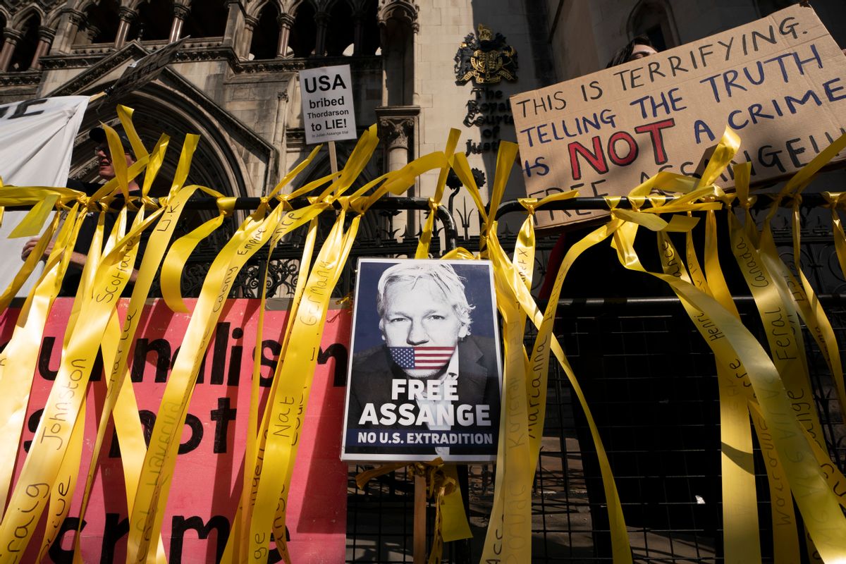 Supporters gather outside as the High Court hears a U.S. appeal in the extradition of WikiLeaks founder Julian Assange, at Royal Courts of Justice, Chancery Lane, London, Aug. 11, 2021.  (Ming Yeung/Getty Images)