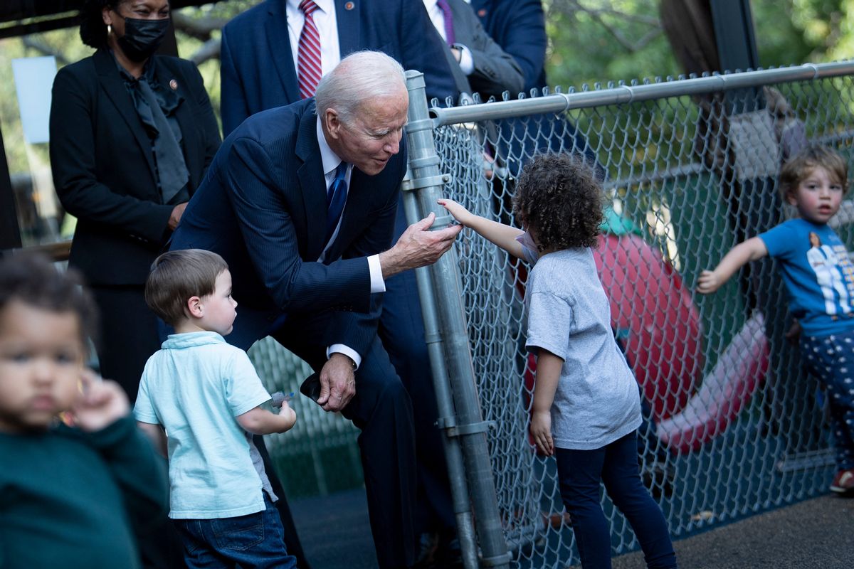 President Joe Biden visits with children at the Capitol Child Development Center October 15, 2021, in Hartford, Connecticut. (BRENDAN SMIALOWSKI/AFP via Getty Images)