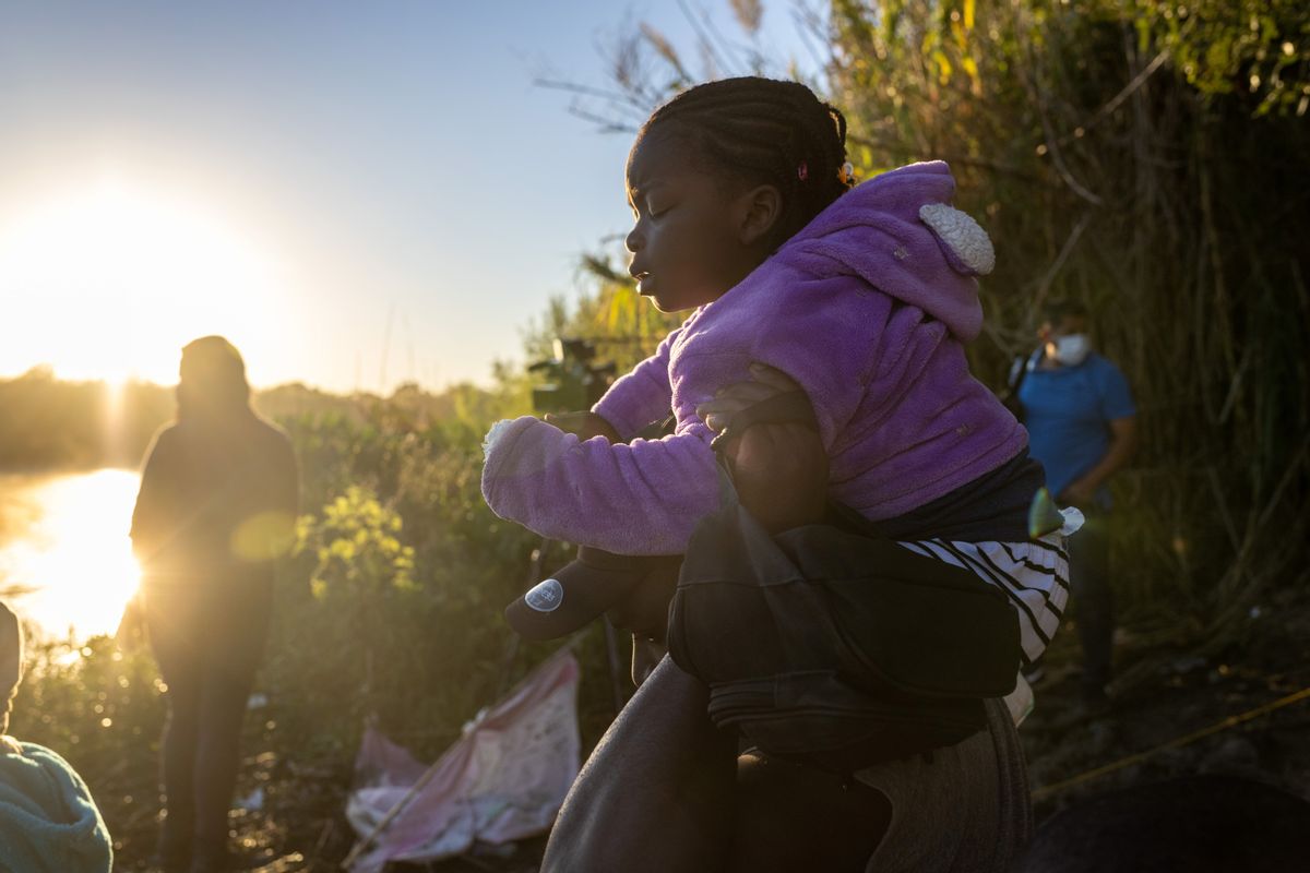 Haitian immigrants prepare to cross the Rio Grande into Del Rio, Texas, on Sept. 23, 2021, from Ciudad Acuna, Mexico.  (John Moore/Getty Images)