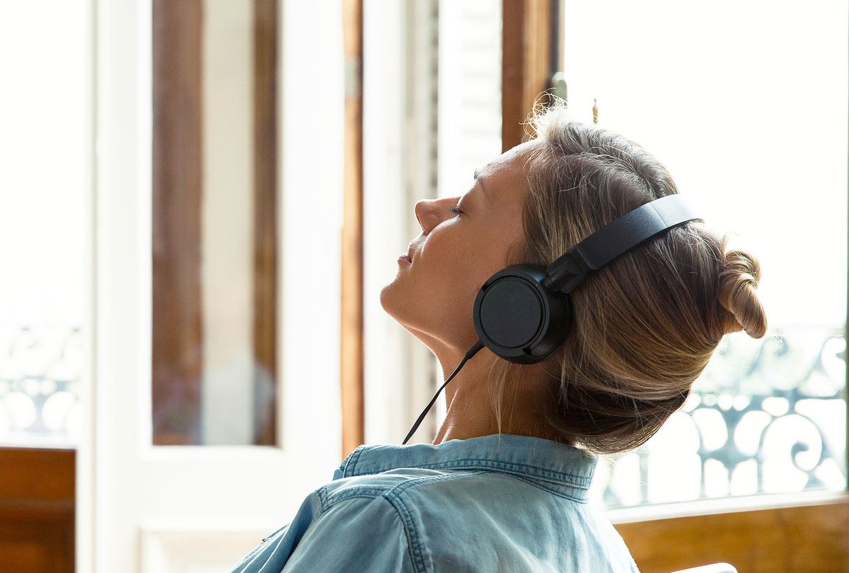Woman relaxing while listening to music (Getty Images/PhotoAlto/Sigrid Olsson)