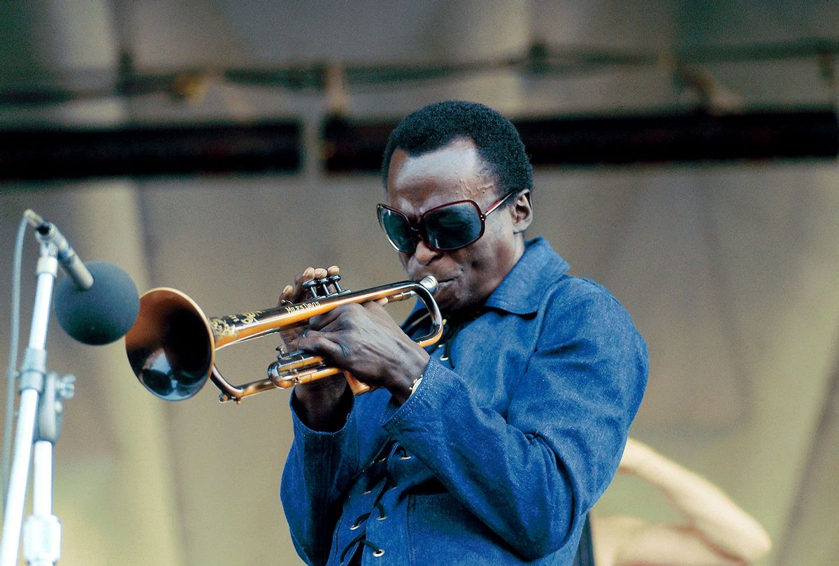 Miles Davis performing live on stage at the Newport Jazz Festival in 1969 (David Redfern/Redferns/Getty Images)