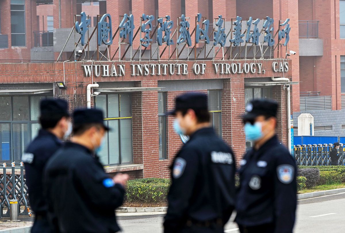 Security personnel stand guard outside the Wuhan Institute of Virology in Wuhan as members of the World Health Organization (WHO) team investigating the origins of the COVID-19 coronavirus make a visit to the institute in Wuhan in China's central Hubei province on February 3, 2021. (HECTOR RETAMAL/AFP via Getty Images)