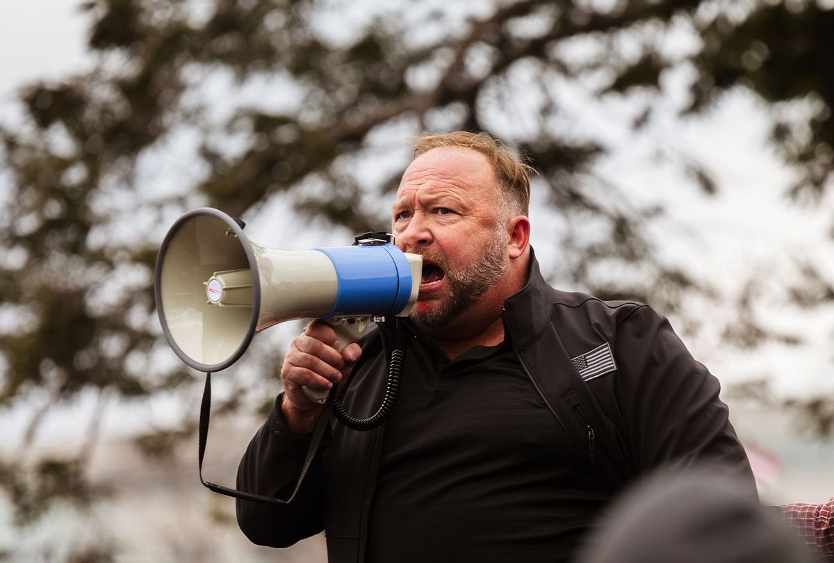 Alex Jones, the founder of right-wing media group Infowars, addresses a crowd of pro-Trump protesters after they storm the grounds of the Capitol Building on January 6, 2021 in Washington, DC. (Jon Cherry/Getty Images)