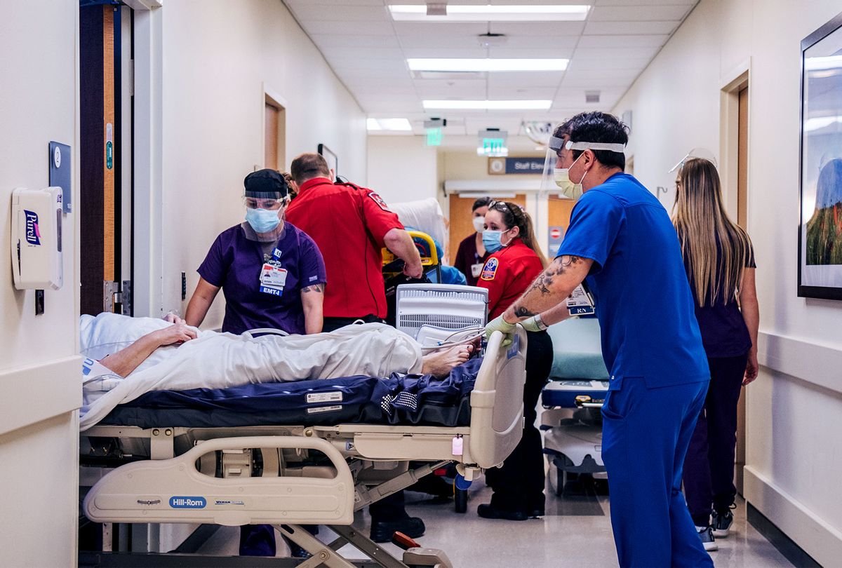 Emergency Room nurses and EMTs tend to patients in hallways at the Houston Methodist The Woodlands Hospital in Houston, Texas. (Brandon Bell/Getty Images)