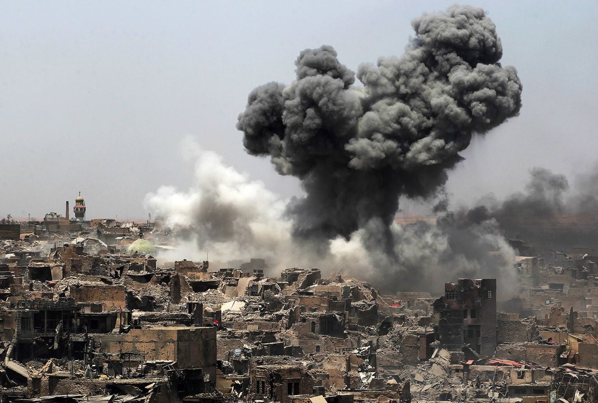 A picture taken on July 9, 2017, shows smoke billowing following an airstrike by US-led international coalition forces targeting Islamic State (IS) group in Mosul. Iraq will announce imminently a final victory in the nearly nine-month offensive to retake Mosul from jihadists, a US general said Saturday, as celebrations broke out among police forces in the city. (AHMAD AL-RUBAYE/AFP via Getty Images)
