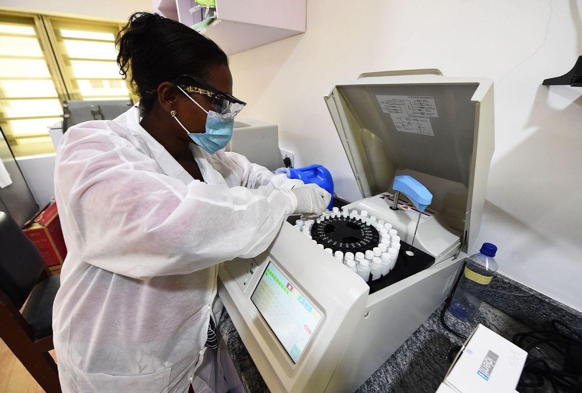 Laboratory assistant director Stella Atewe analyses chemistry profiles at the Lagos State Isolation Centre in Yaba, Lagos, on January 22, 2021. - The number of confirmed COVID-19 cases in Nigeria is increasing rapidly following daily reports by the Nigeria Centre for Disease Control (NCDC) even as Lagos, Nigeria's commercial capital, accounted for the highest number of cases in the country. (PIUS UTOMI EKPEI/AFP via Getty Images)