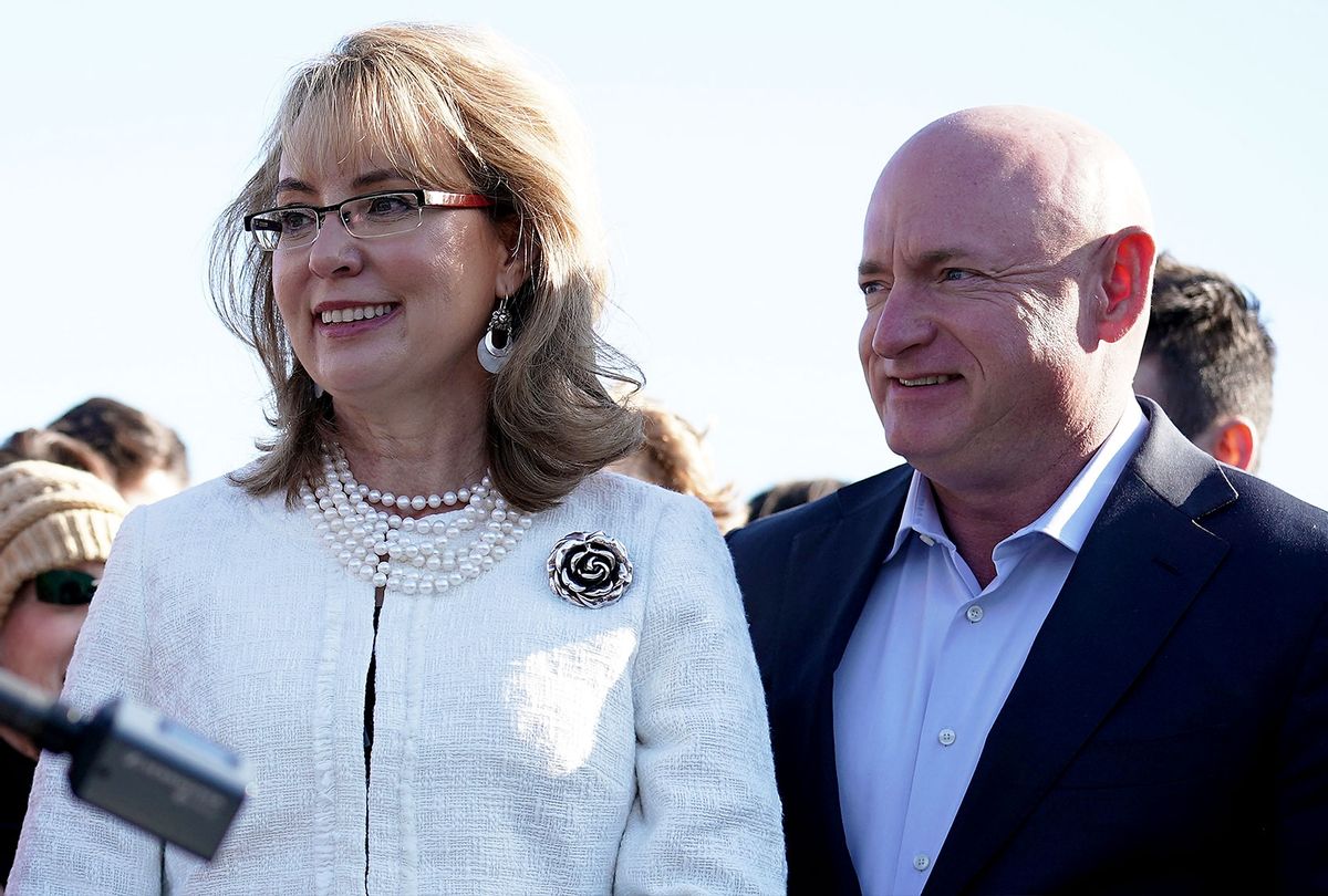 Former U.S. Rep. Gabrielle Giffords (D-AZ) (L) and her husband, retired Navy combat veteran and NASA astronaut Mark Kelly (R), participate in a news conference on gun control March 23, 2018 on Capitol Hill in Washington, DC. The lawmaker, joined by students and gun control advocates, held a news conference "to demand action on gun safety." (Alex Wong/Getty Images)