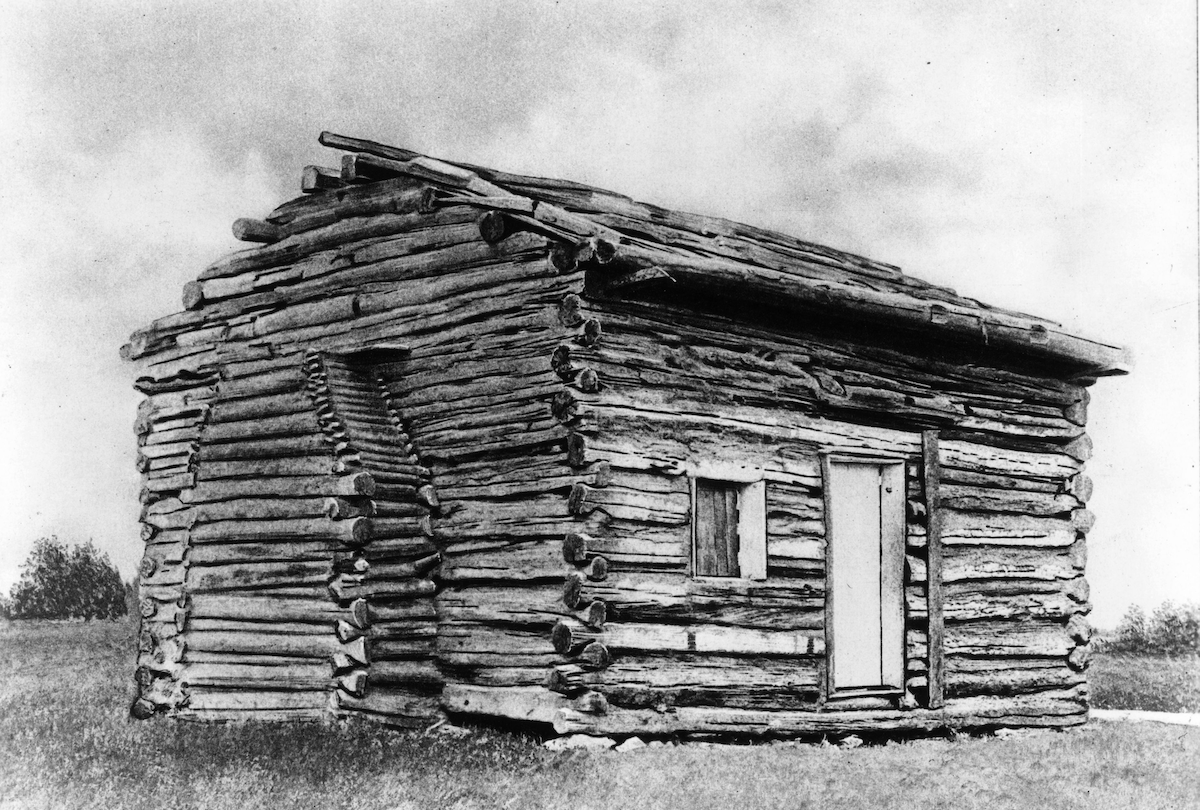 The simple log cabin in which US president Abraham Lincoln was born in 1809. The cabin stands on the Kentucky farm belonging to Lincoln's father and still exists, housed within a museum building. (MPI/Getty Images)