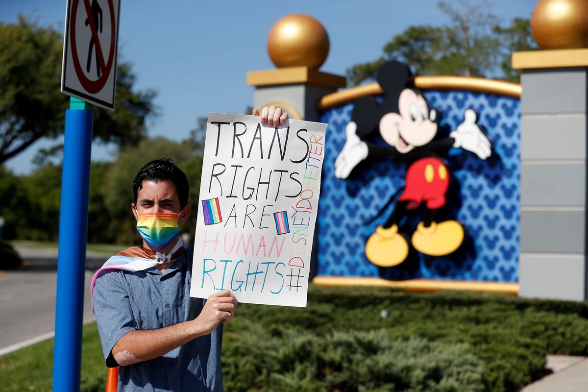 Disney employee Nicholas Maldonado holds a sign while protesting outside of Walt Disney World on March 22, 2022 in Orlando, Florida. (Octavio Jones/Getty Images)