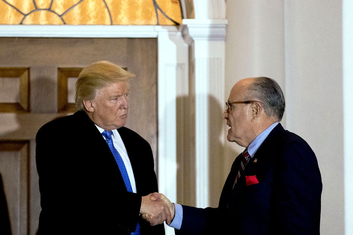 President-elect Donald Trump and former New York City mayor Rudy Giuliani shake hands following their meeting at Trump International Golf Club, November 20, 2016 in Bedminster Township, New Jersey. (Drew Angerer/Getty Images)