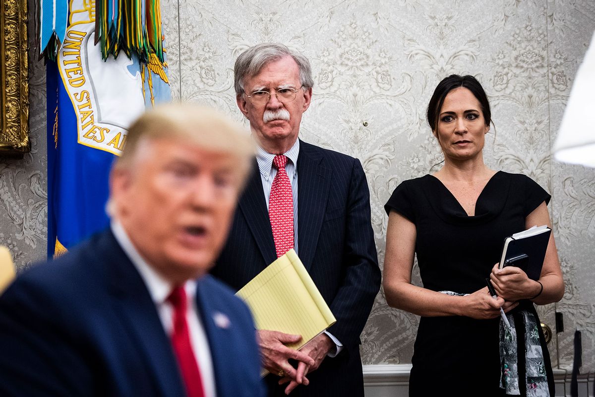 National Security Advisor John R. Bolton and White House Press Secretary Stephanie Grisham listen as President Donald J. Trump participates in a meeting with Amir of the State of Qatar Sheikh Tamim Bin Hamad Al Thani in the Oval Office at the White House on Tuesday, July 9th, 2019 in Washington, DC. (Jabin Botsford/The Washington Post via Getty Images)