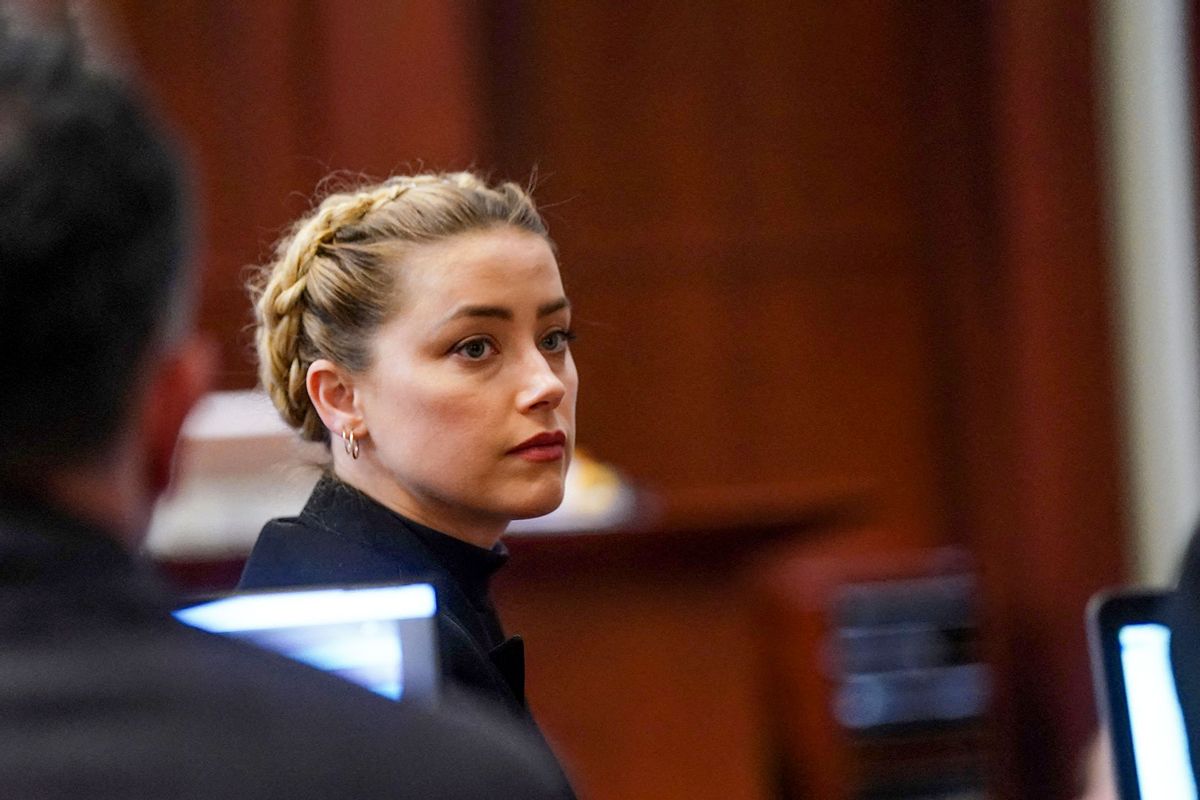 US actress Amber Heard looks over he shoulder during the 50 million US dollars Depp vs Heard defamation trial at the Fairfax County Circuit Court in Fairfax, Virginia,on April 14, 2022. (SHAWN THEW/POOL/AFP via Getty Images)