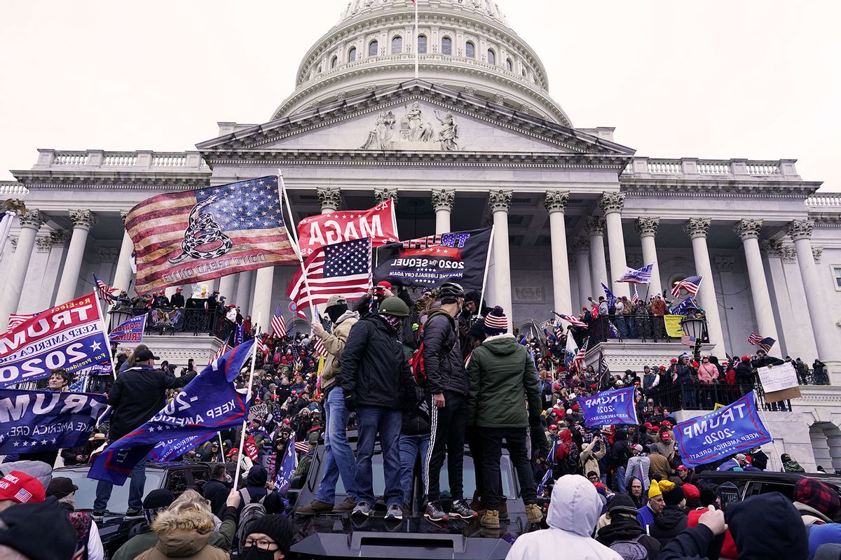 Protesters fueled by President Donald Trump's continued claims of election fraud march in an attempt to overturn the results before Congress finalizes them in a joint session of the 117th Congress on Wednesday, Jan. 6, 2021 in Washington, DC. (Kent Nishimura / Los Angeles Times via Getty Images)