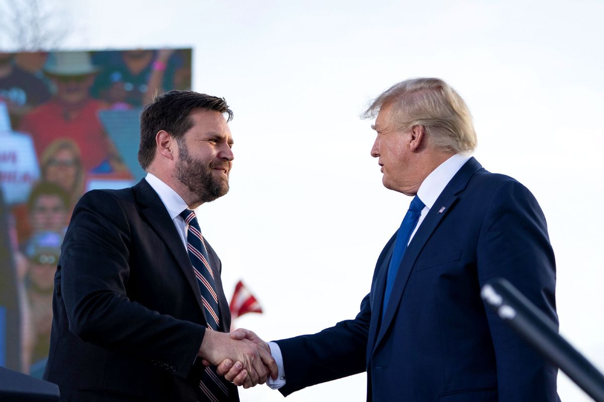 J.D. Vance, a Republican candidate for U.S. Senate in Ohio, shakes hands with former President Donald Trump during a rally hosted by the former president at the Delaware County Fairgrounds on April 23, 2022 in Delaware, Ohio. (Drew Angerer/Getty Images)