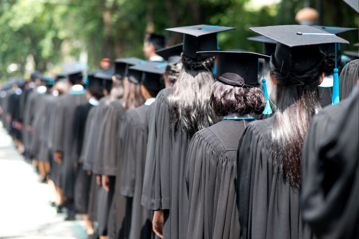 Rear View Of People Lined Up At Graduation Ceremony (Getty Images / Supachok Pichetkul / EyeEm)