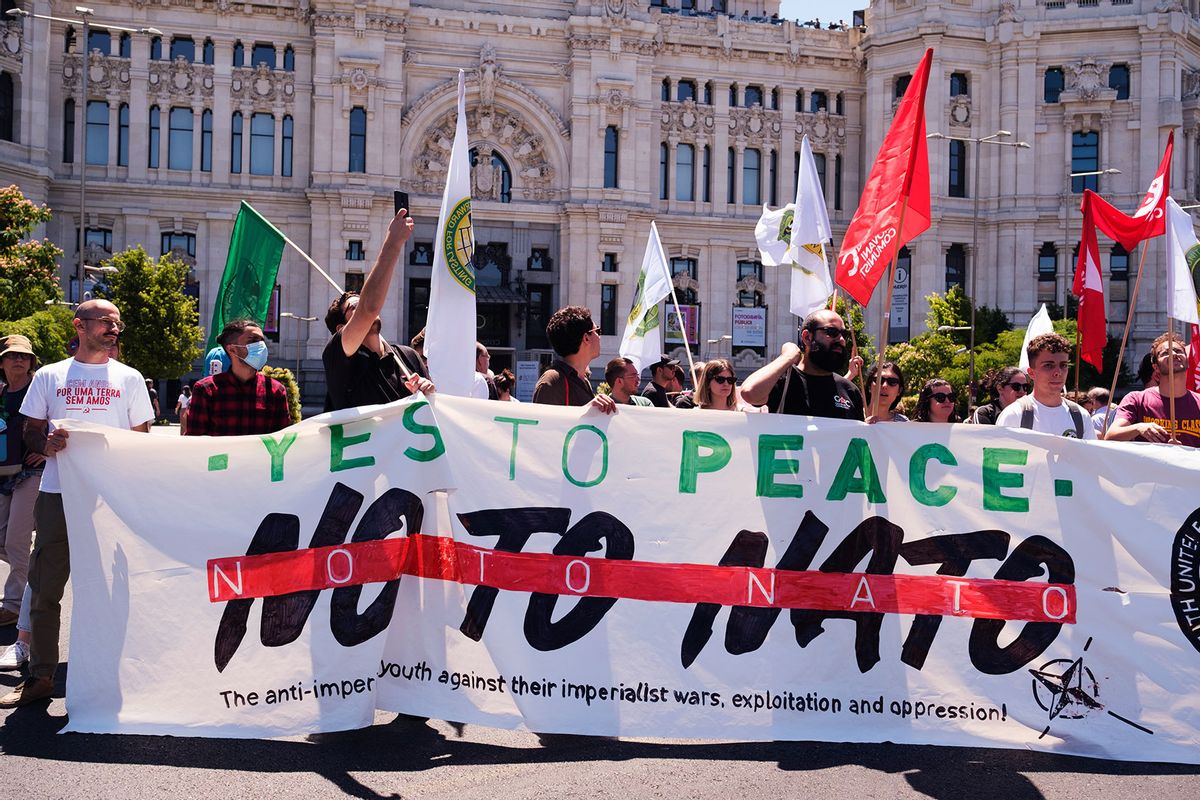 Protesters hold a banner that says "No to Nato" during a demonstration. The mobilization was to reject the summit of the Atlantic Alliance in Madrid, on June 29th and 30th. At the end of the protest, a manifesto was read advocating the dissolution of this intergovernmental military alliance governed by the North Atlantic Treaty Organization. (Atilano Garcia/SOPA Images/LightRocket via Getty Images)