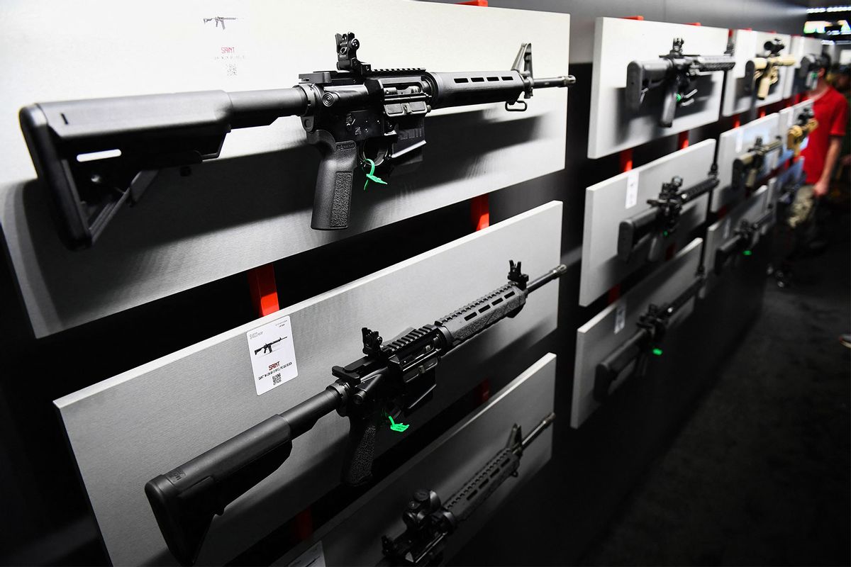 AR-15 semi-automatic rifle is displayed on a wall of guns during the National Rifle Association (NRA) Annual Meeting at the George R. Brown Convention Center, in Houston, Texas on May 28, 2022. (PATRICK T. FALLON/AFP via Getty Images)