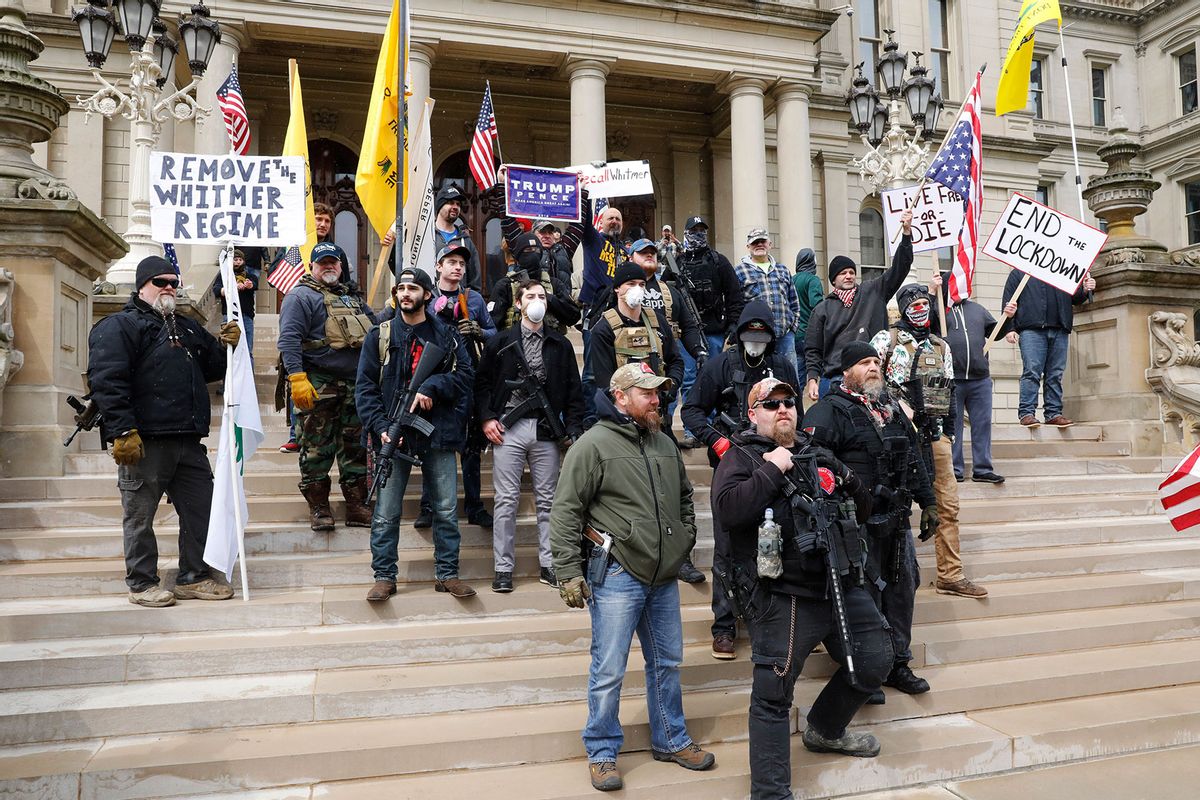 People take part in a protest for "Michiganders Against Excessive Quarantine" at the Michigan State Capitol in Lansing, Michigan on April 15, 2020. (Jeff Kowalsky/AFP via Getty)