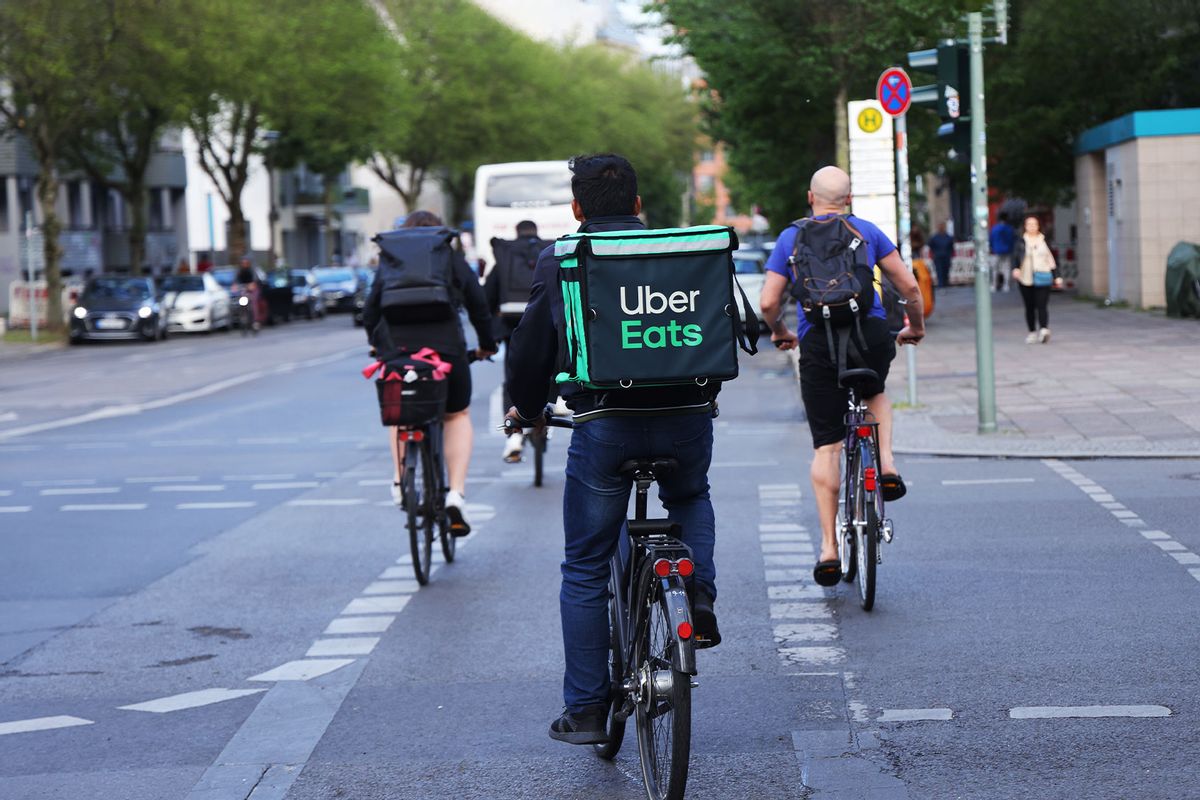 A food courier of Uber Eats rides a bicycle (Sean Gallup/Getty Images)