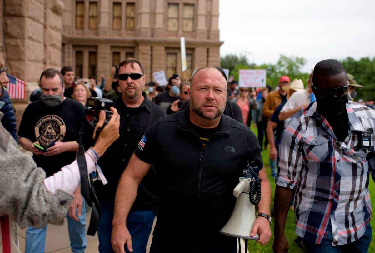 Infowars host Alex Jones marches with protesters during the "Reopen America" rally on April 18, 2020 at the State Capitol in Austin, Texas.  (MARK FELIX/AFP /AFP via Getty Images)